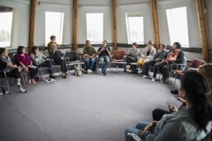 A group of EntrepreNorth participants sits in a circle.