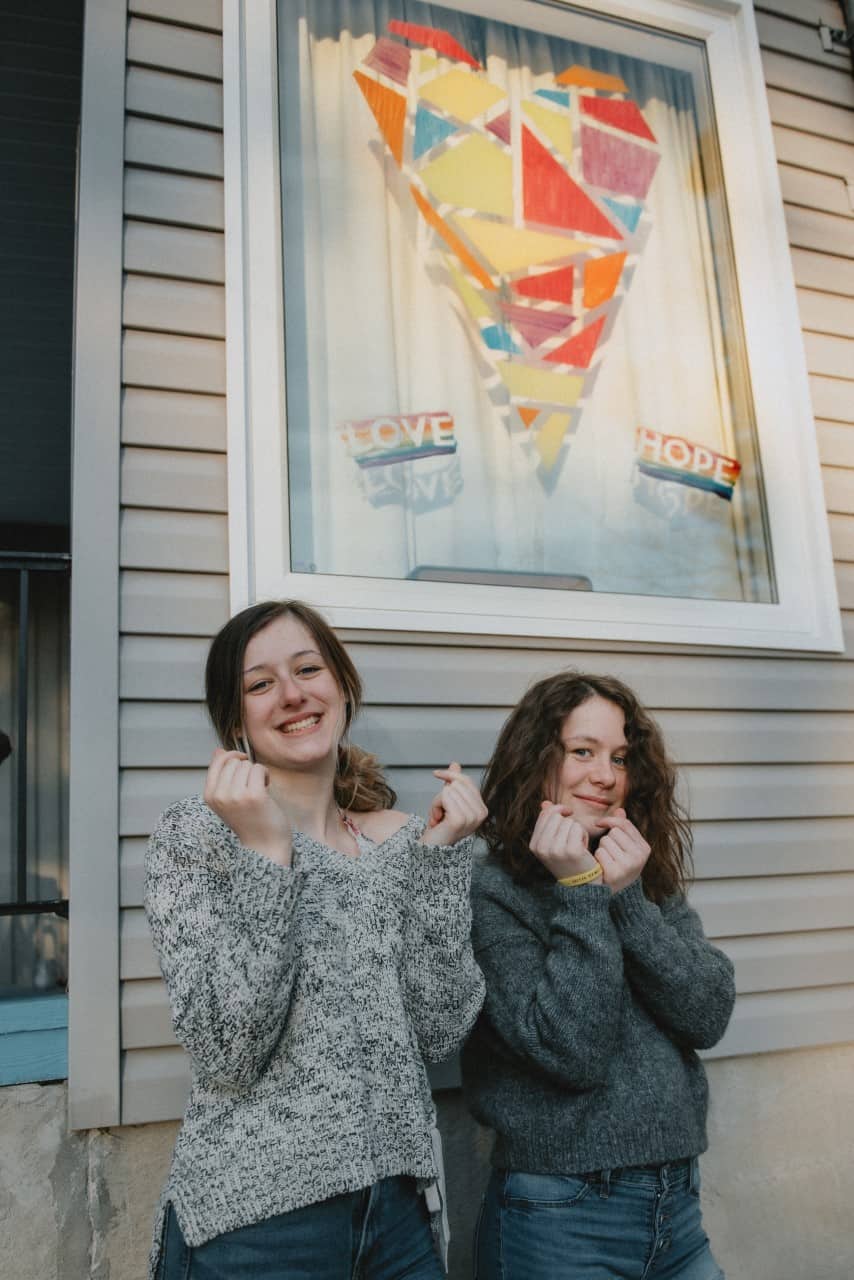 Image of girls in front of their home in Killaloe, Ontario