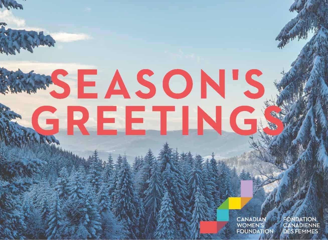 E-card image showing snow-covered trees and seasons greetings message